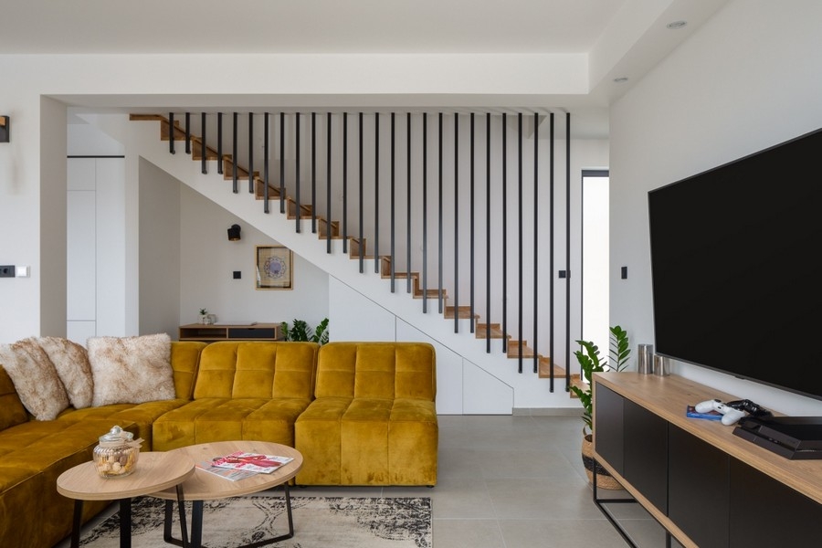 Modern living area with stairs and TV lounge