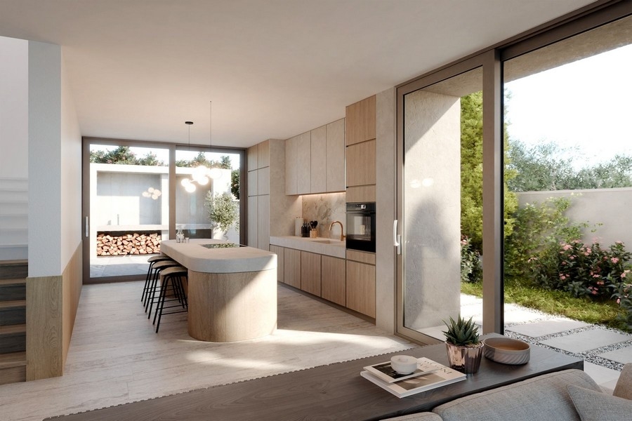 Modern kitchen with cooking island and access to the garden