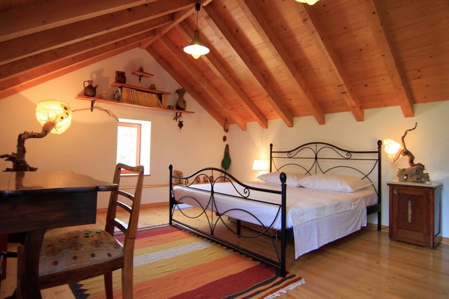 Bedroom in the attic of house H3828 in Croatia.
