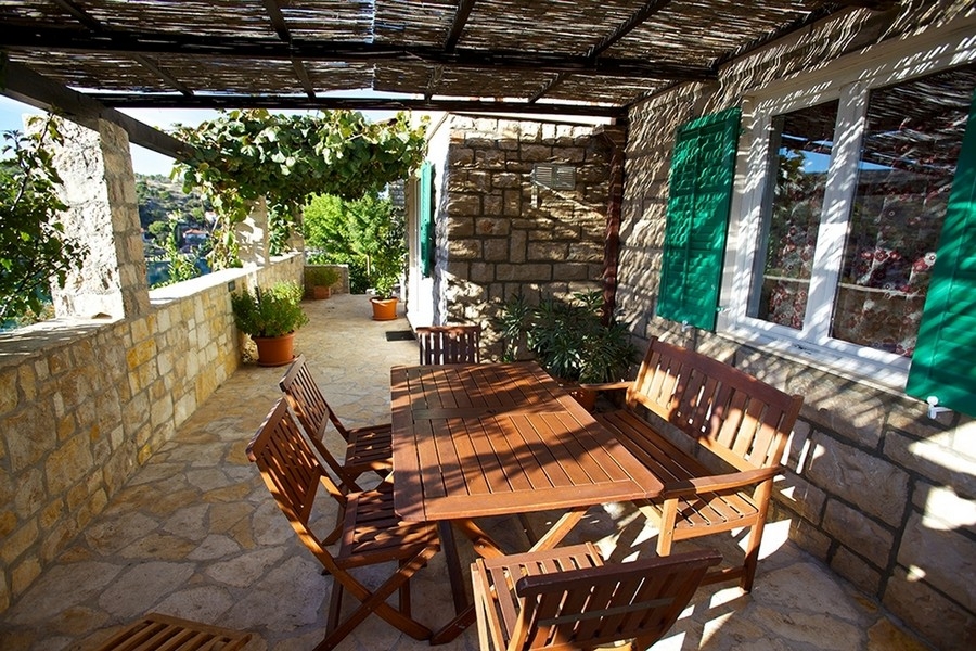 Mediterranean terrace with pergola and seating area
