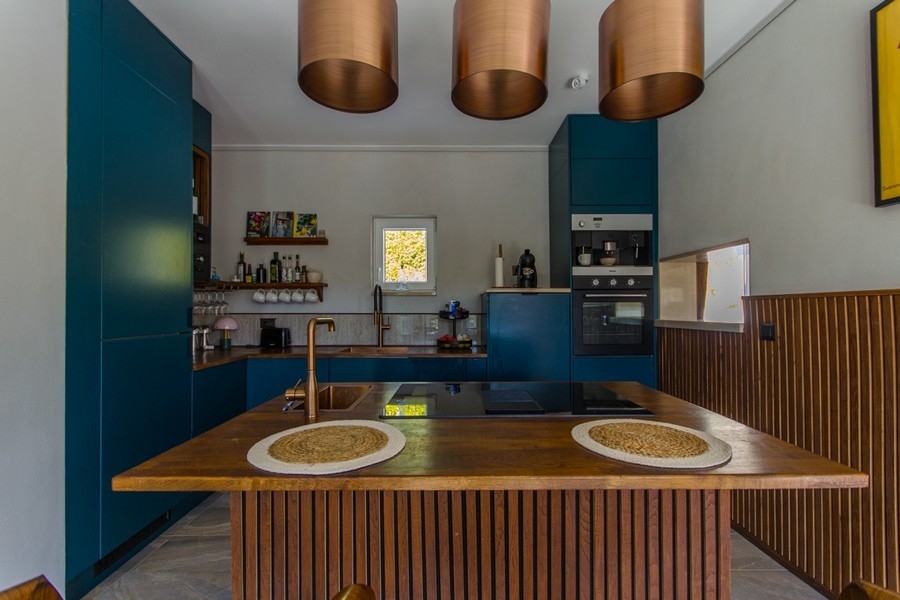 Kitchen with island and copper lamps