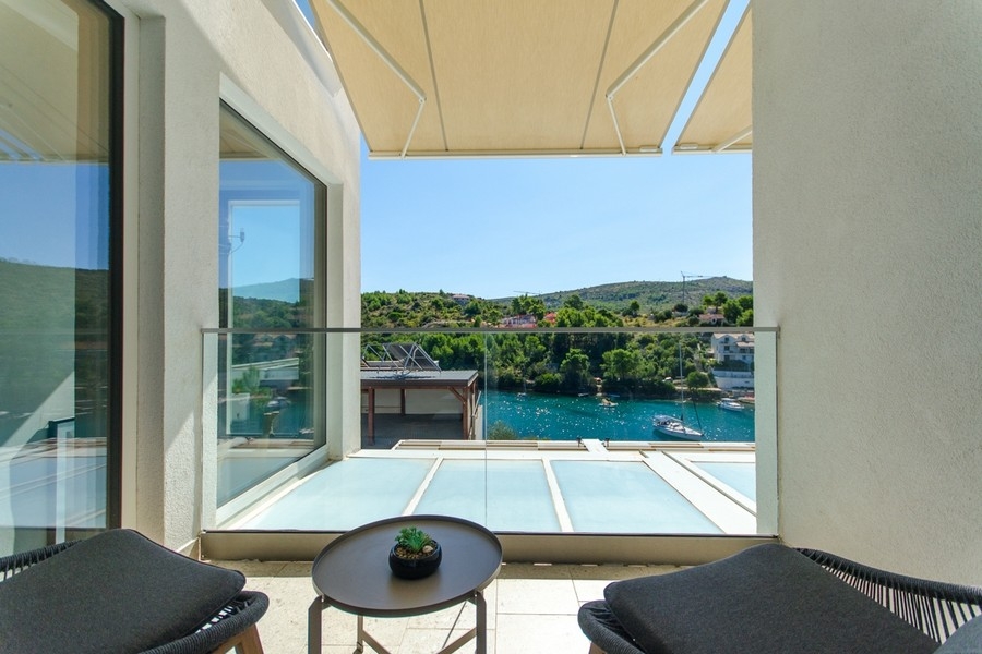 Balcony with seating area and bay views