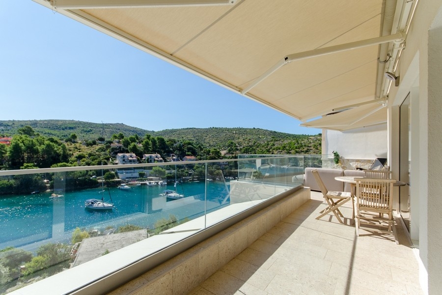 Balcony with glass railings and views of the Bay of Brač
