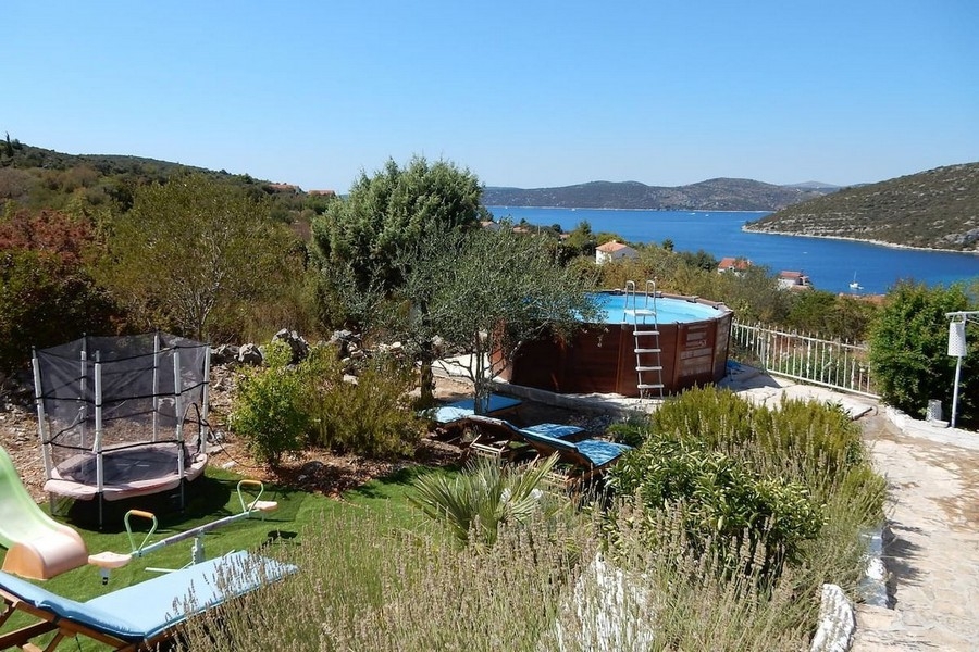 Garden with pool and sea views
