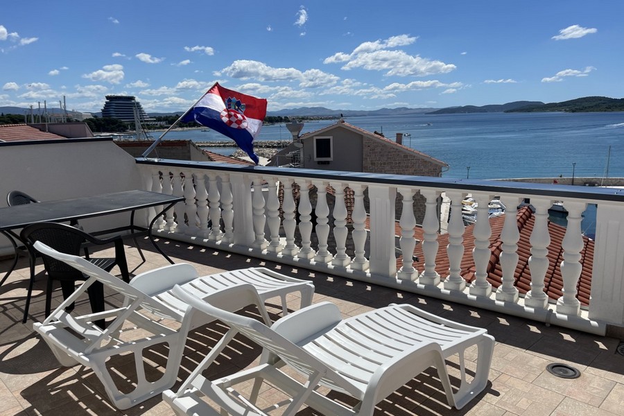 Terrace with sun loungers and sea views in Croatia
