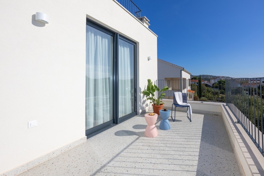 Terrace on the upper floor with seating