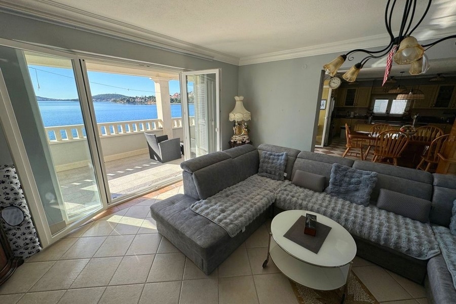 Bright living area with large windows and sea views