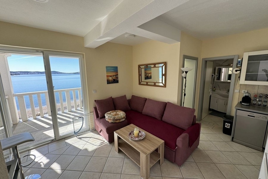 Studio apartment with a sofa and a balcony with sea views