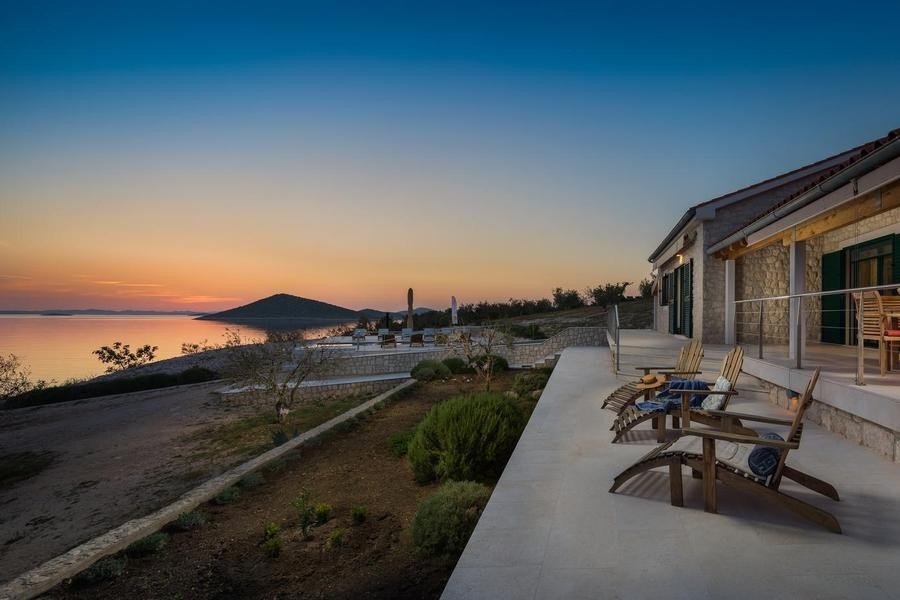 Terrace of the villa with sea view at sunset