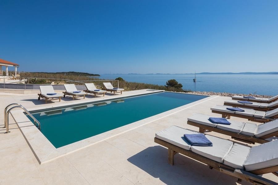 Swimming pool with sun terrace and sea views