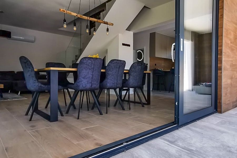 Dining area with access to the terrace and pool area