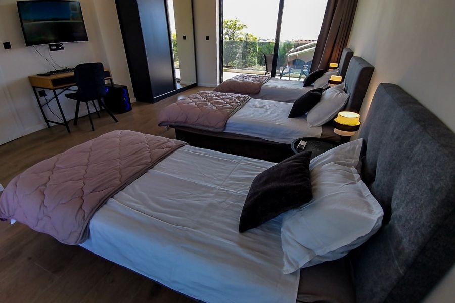 Bedroom with balcony in modern villa in Croatia