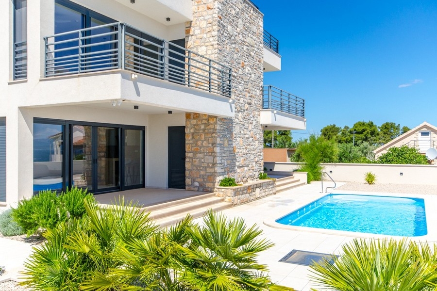 Modern villa with four apartments for sale on the island of Solta in Croatia.