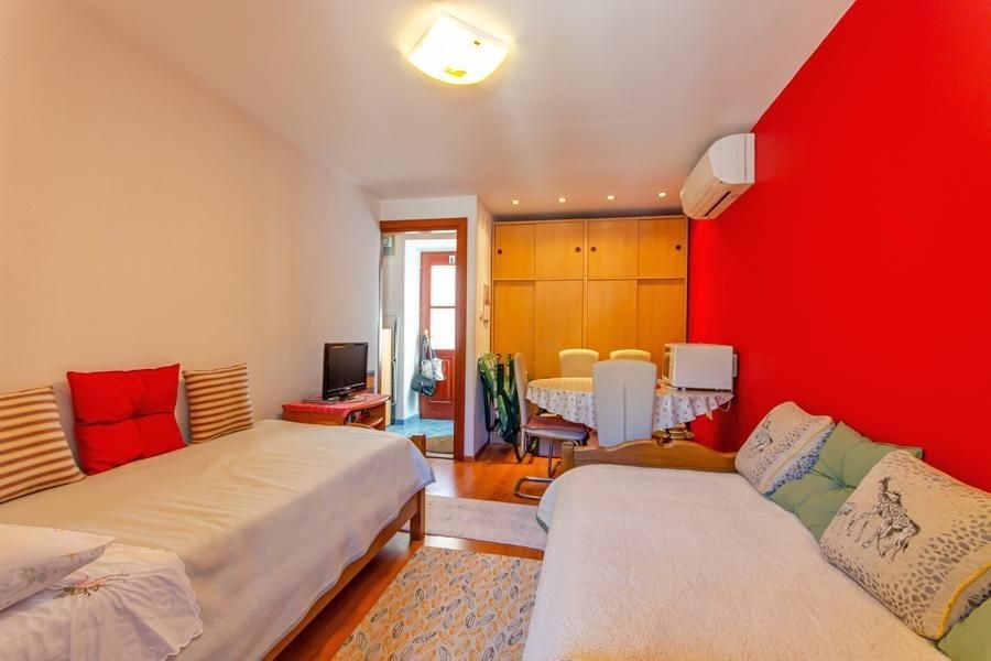 Bedroom with seating area and air conditioning