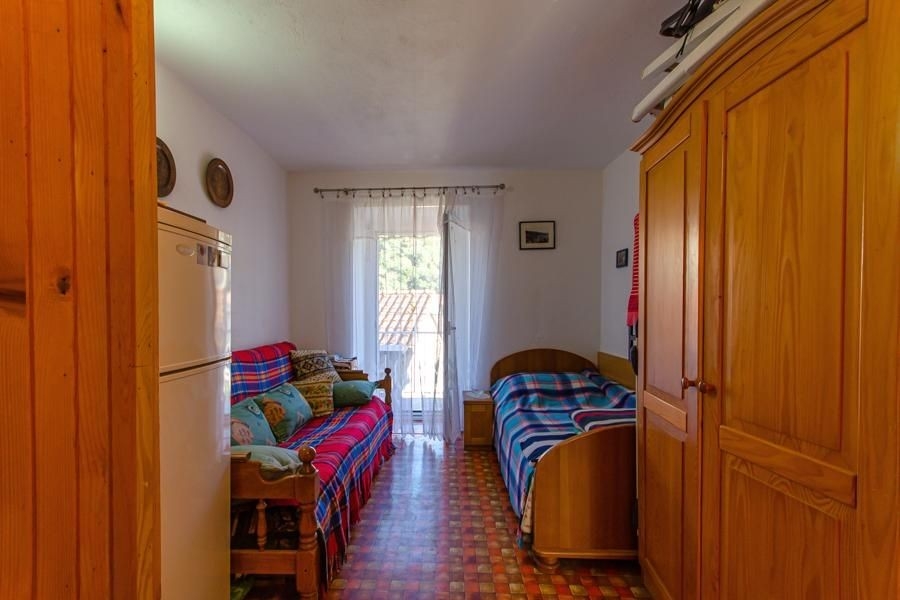 Bedroom with wardrobe and balcony