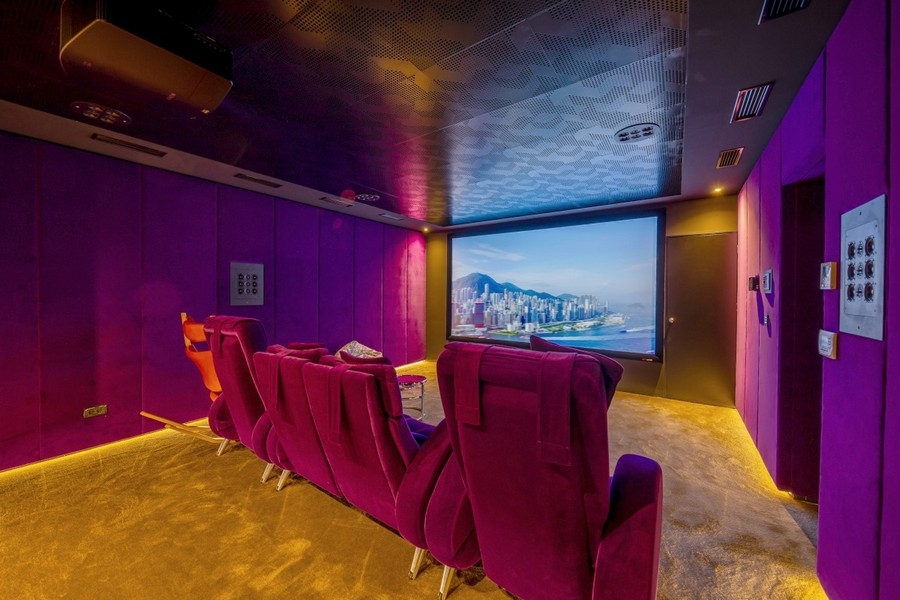 Private home cinema with comfortable armchairs