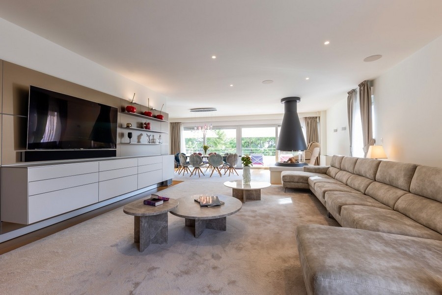 Spacious living area with modern furnishings and fireplace