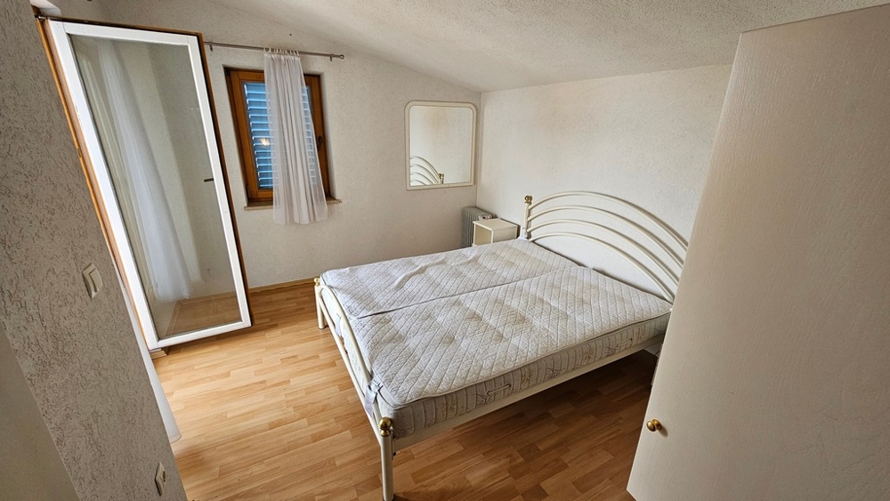 Bedroom with double bed and wardrobe