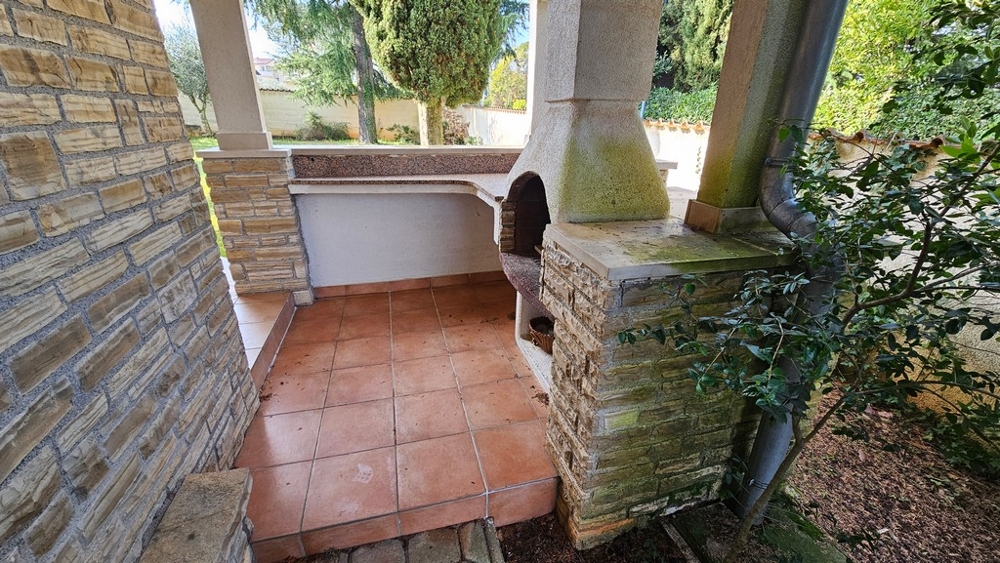 Outdoor kitchen with grill on the terrace