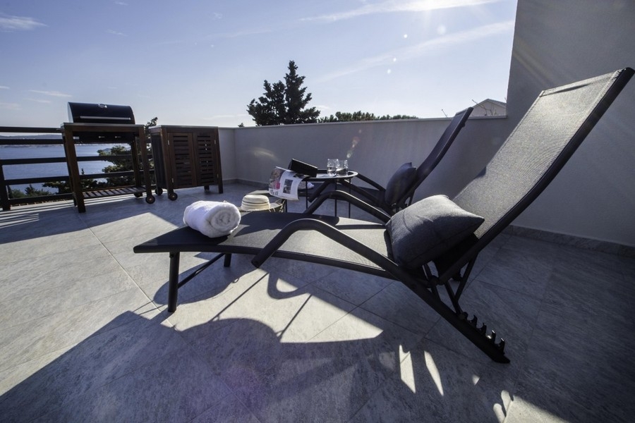Roof terrace with loungers and sea views