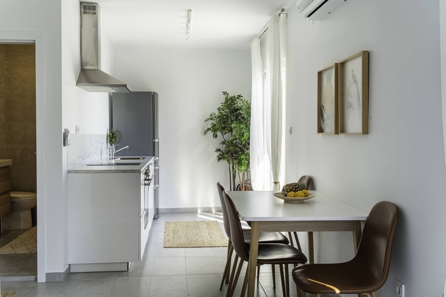 Kitchen and dining area with large window and natural light