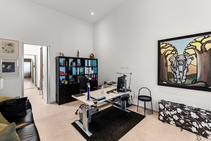 Study room with desk and shelves