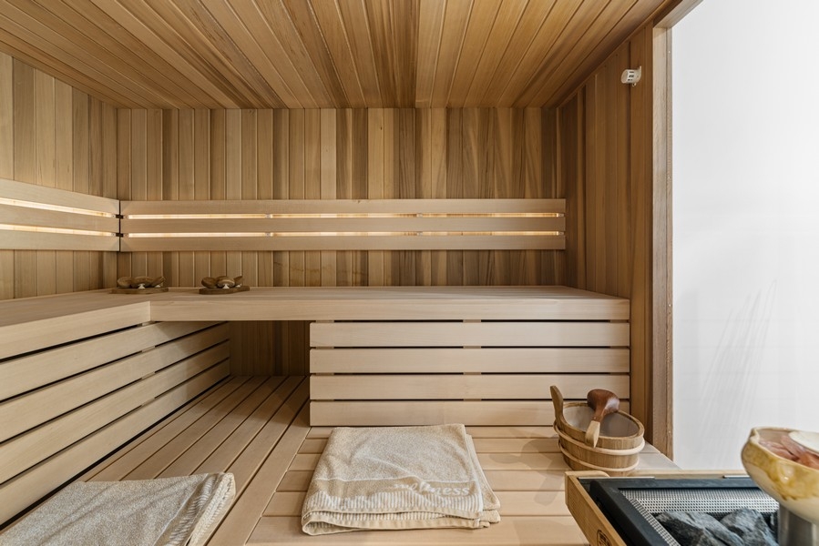 Sauna with wooden paneling in the wellness area