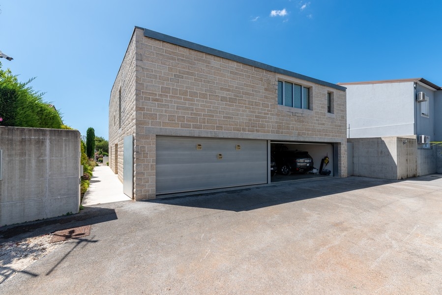 Exterior view of the villa with natural stone facade