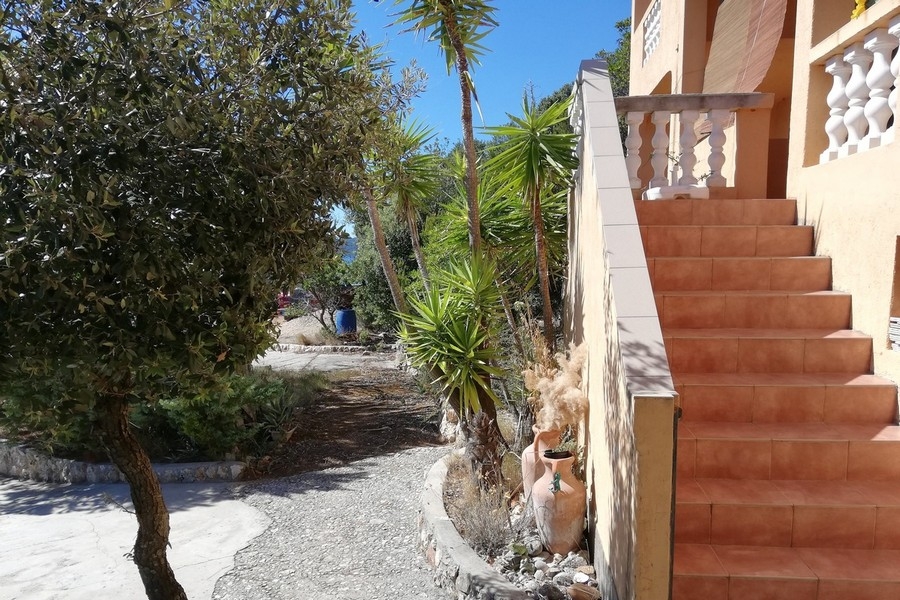 Mediterranean garden and entrance gate of the island property