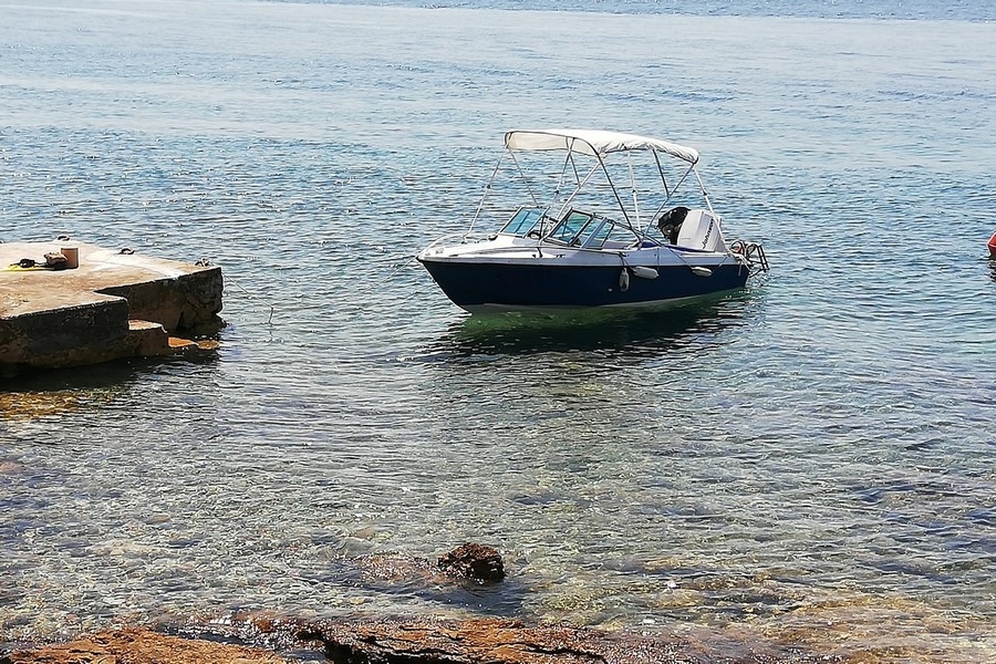 Boat at the private dock in front of the property in Croatia