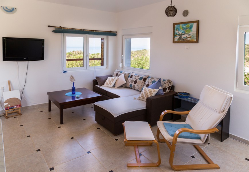Living room with sofa and sea view