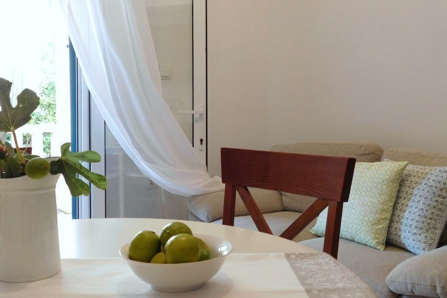 Living area with sofa and dining area