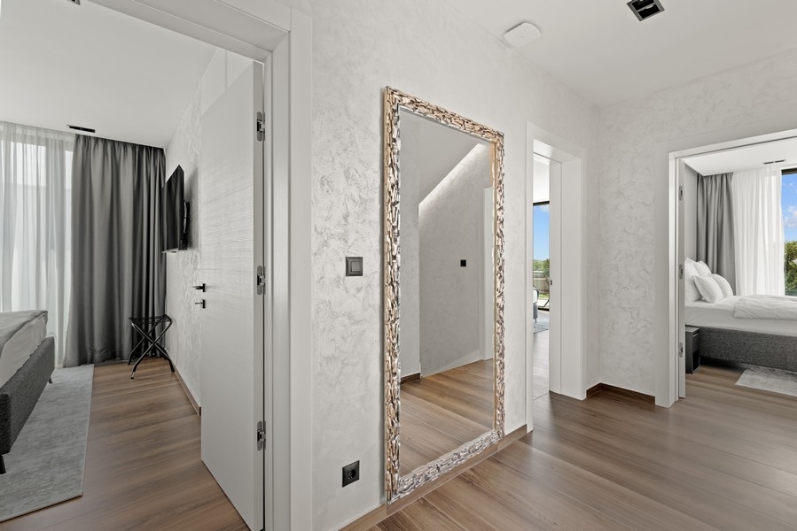 Bedroom with large window and view of the greenery