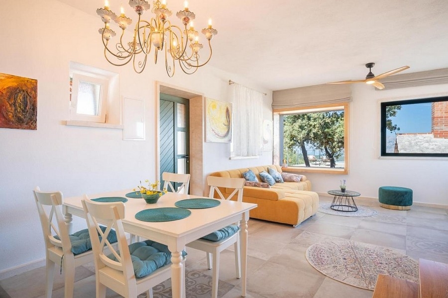Dining area with living room and Mediterranean interior