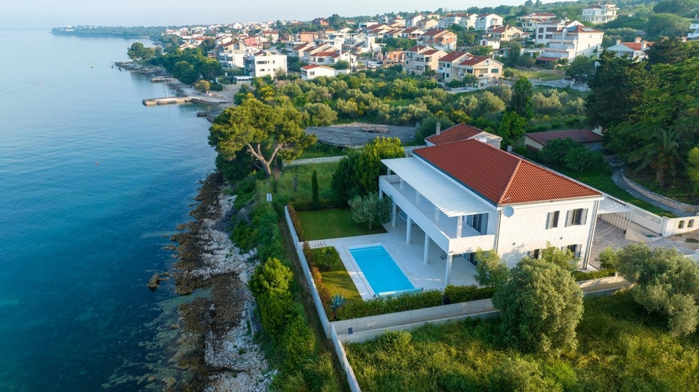 Stone villa in the first row to the sea with pool and garden in Dalmatia