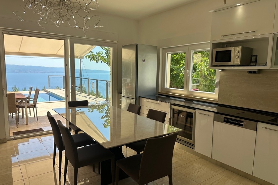 Kitchen overlooking terrace and sea