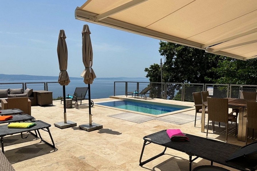 Sun terrace with loungers and views of the sea
