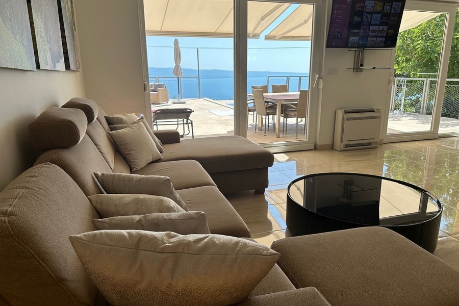 Living area with access to the terrace and sea views