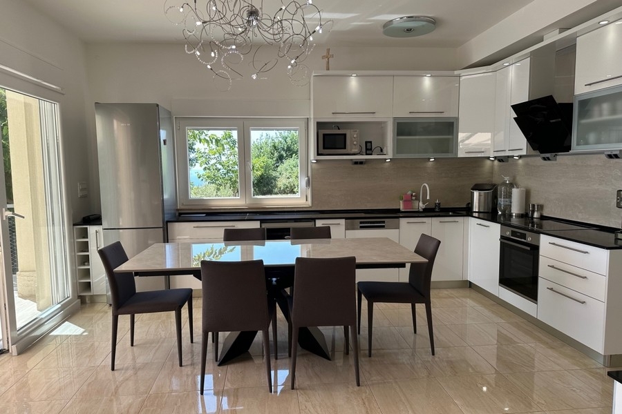 Modern kitchen with dining area and high quality appliances