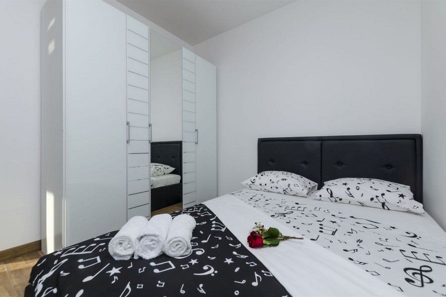 Bedroom with bed and wardrobe