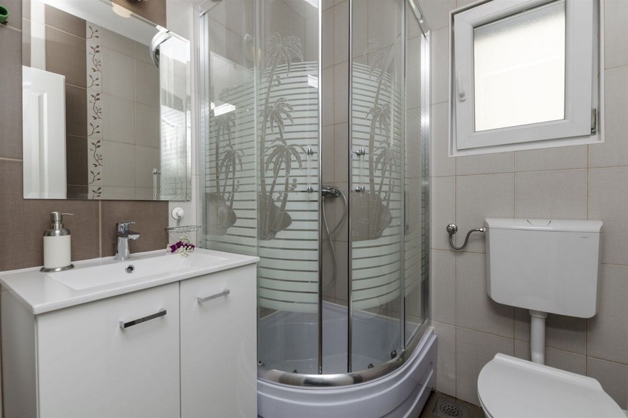 Bathroom with shower and sink