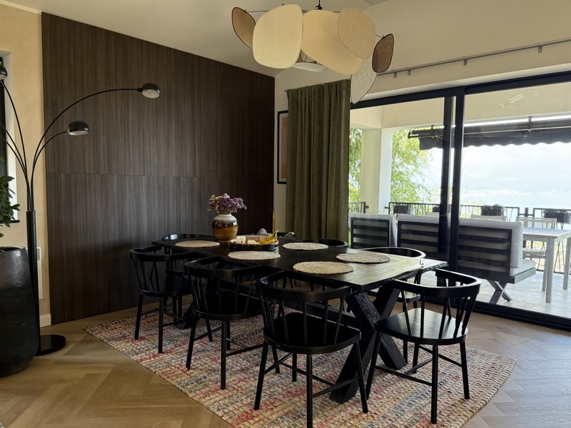 Dining area with access to the terrace and sea views
