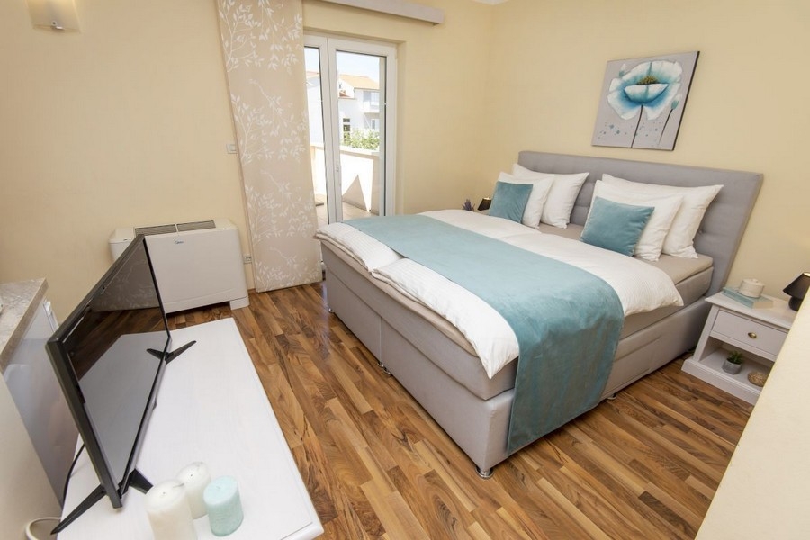 Bedroom with double bed and balcony access