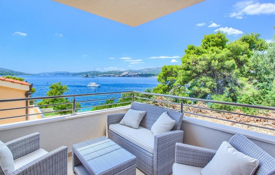 Terrace with seating and sea views of the coast