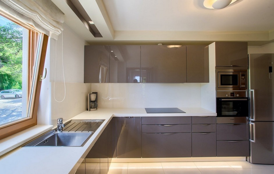 Modern kitchen with built-in appliances and window