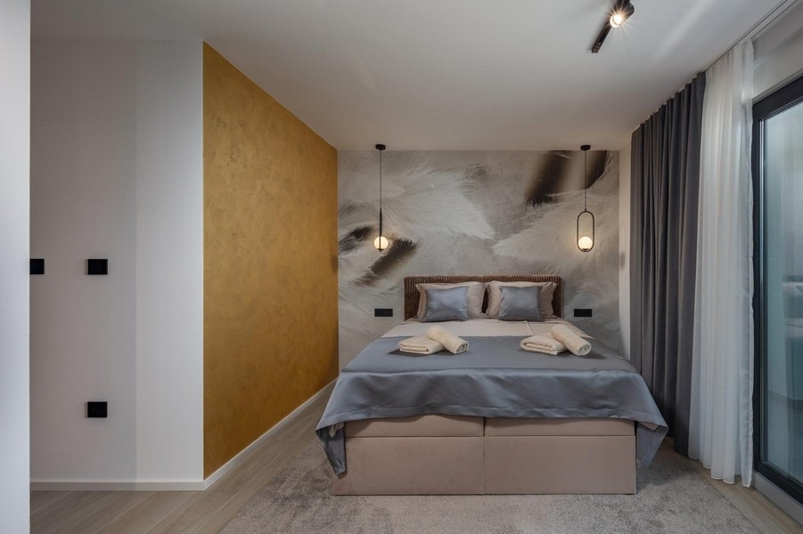 Comfortable bedroom with stylish wall design