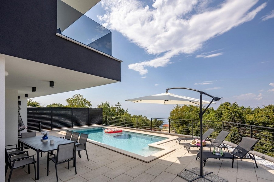Terrace with pool and view of the green surroundings