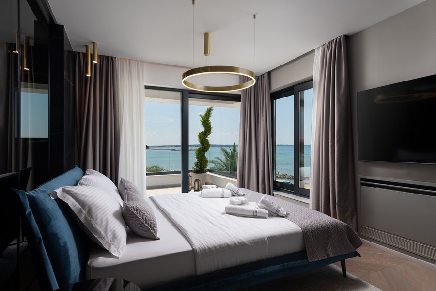 Bedroom with large windows and sea views in Croatia