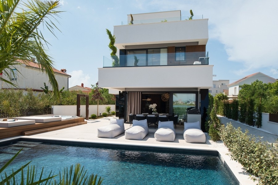 Modern pool villa for sale directly on the sea near Zadar.