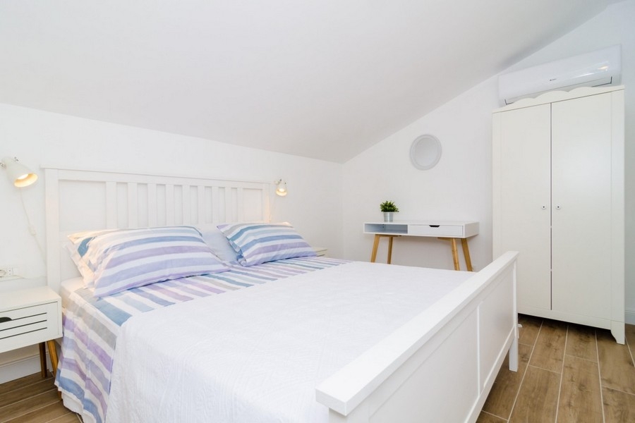 Bright bedroom with sloping ceiling